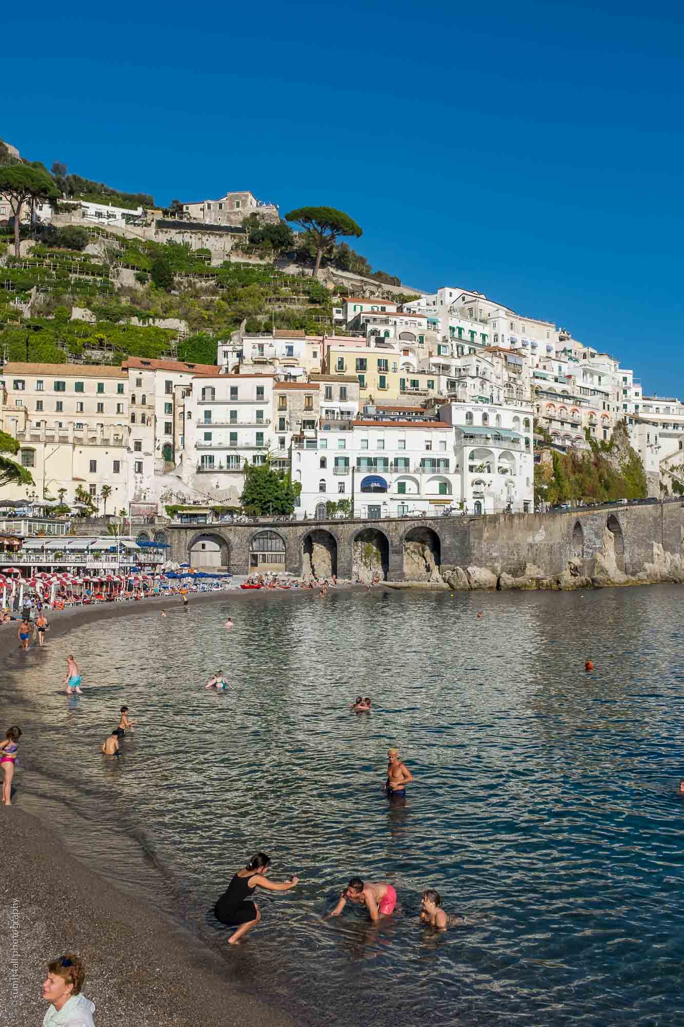 People Enjoying by the Coast in Amalfi, Italy