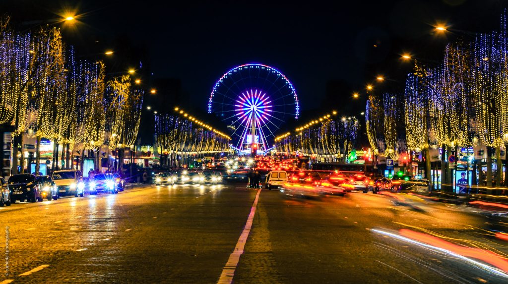 The Egyptian Obelisk and the Giant Wheel put up during Christmas at the Place de la Concorde as seen from the Champs Elysees which is also illuminated