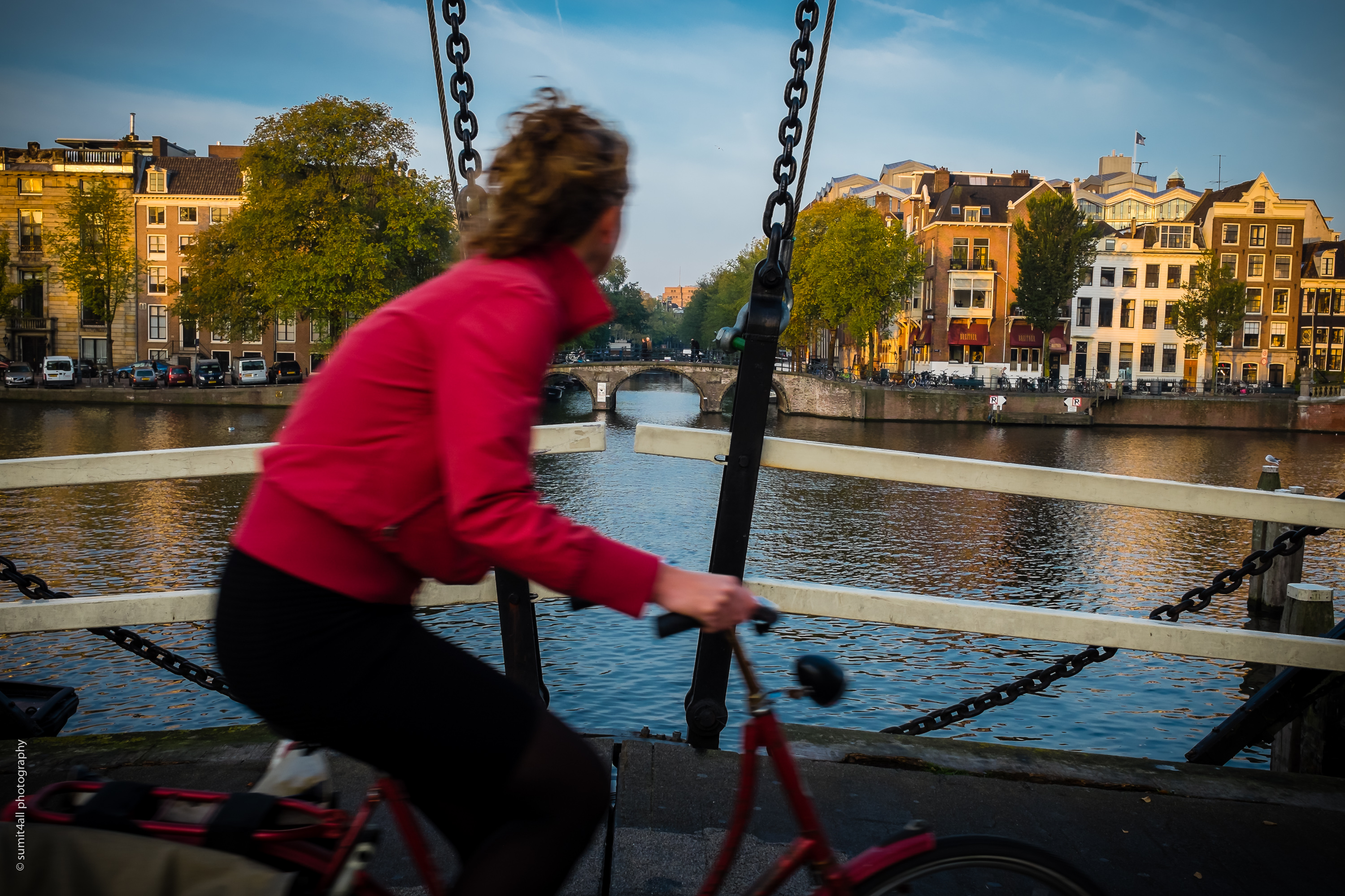 Fresh rays of sunshine over houses by the Amstel river