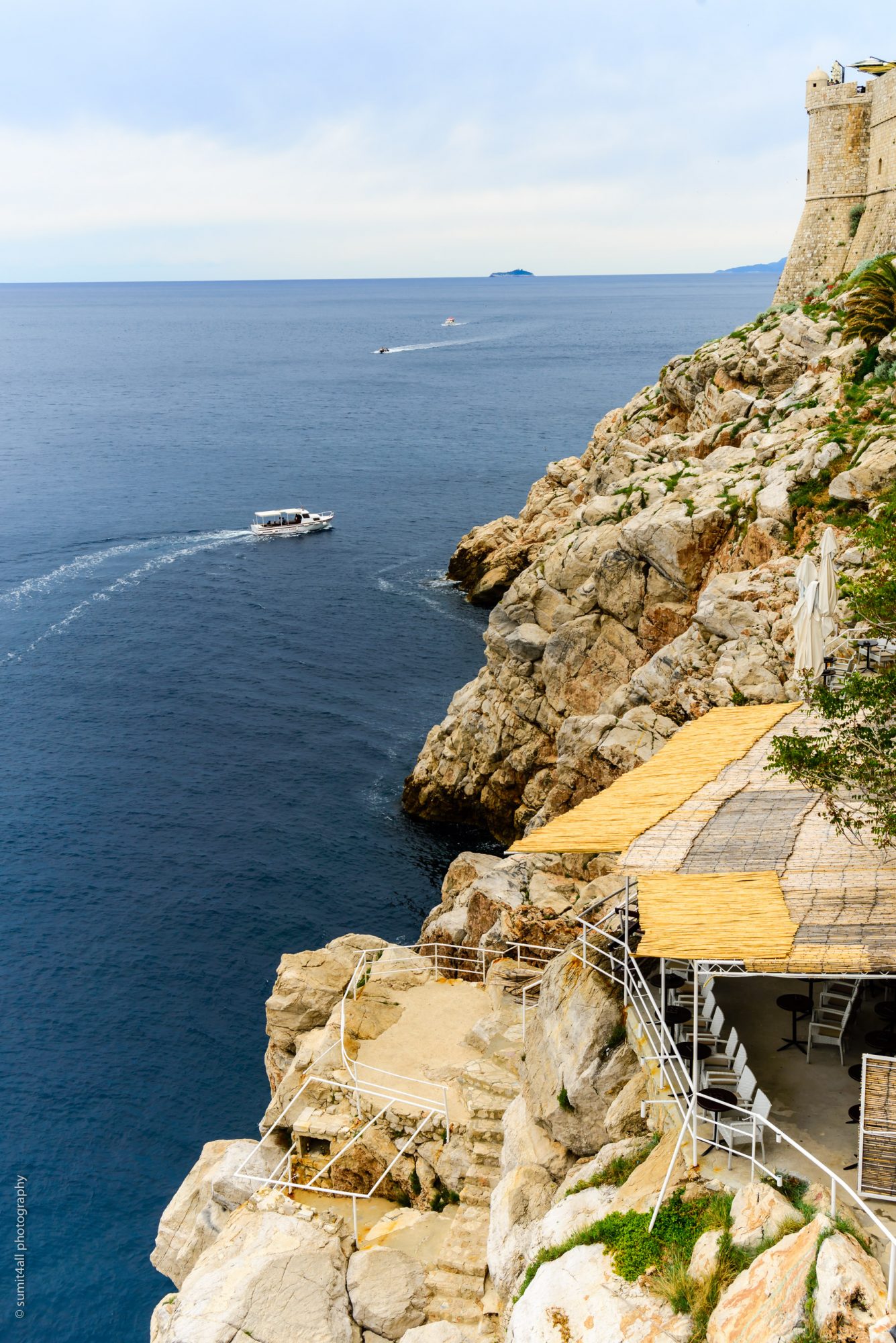 Boats cruising on the Adriatic Coast alongside Dubrovnik