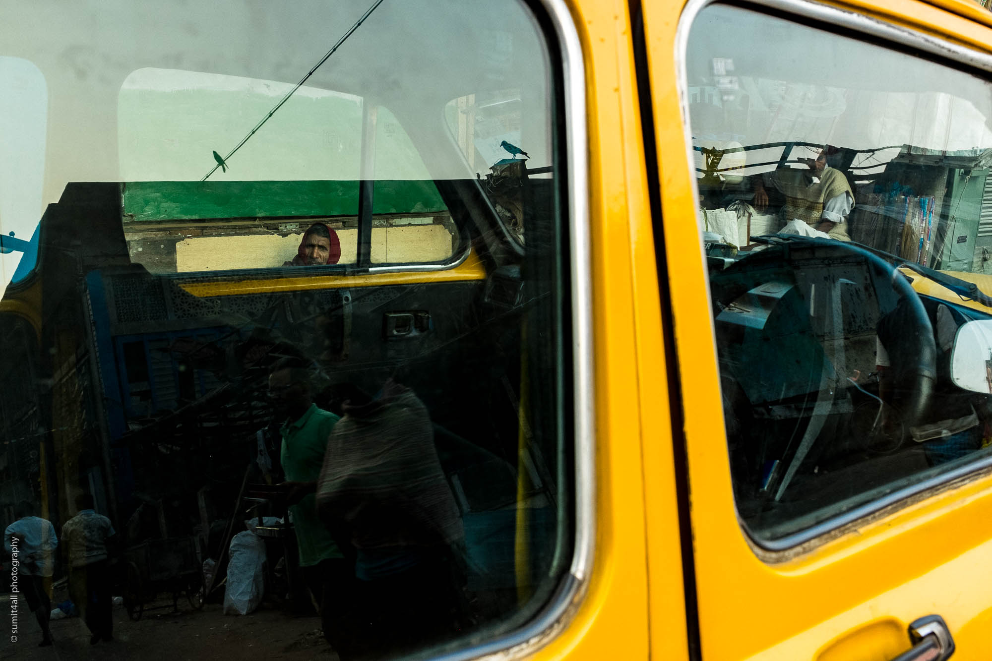 Reflections on a Yellow Taxi in Kolkata