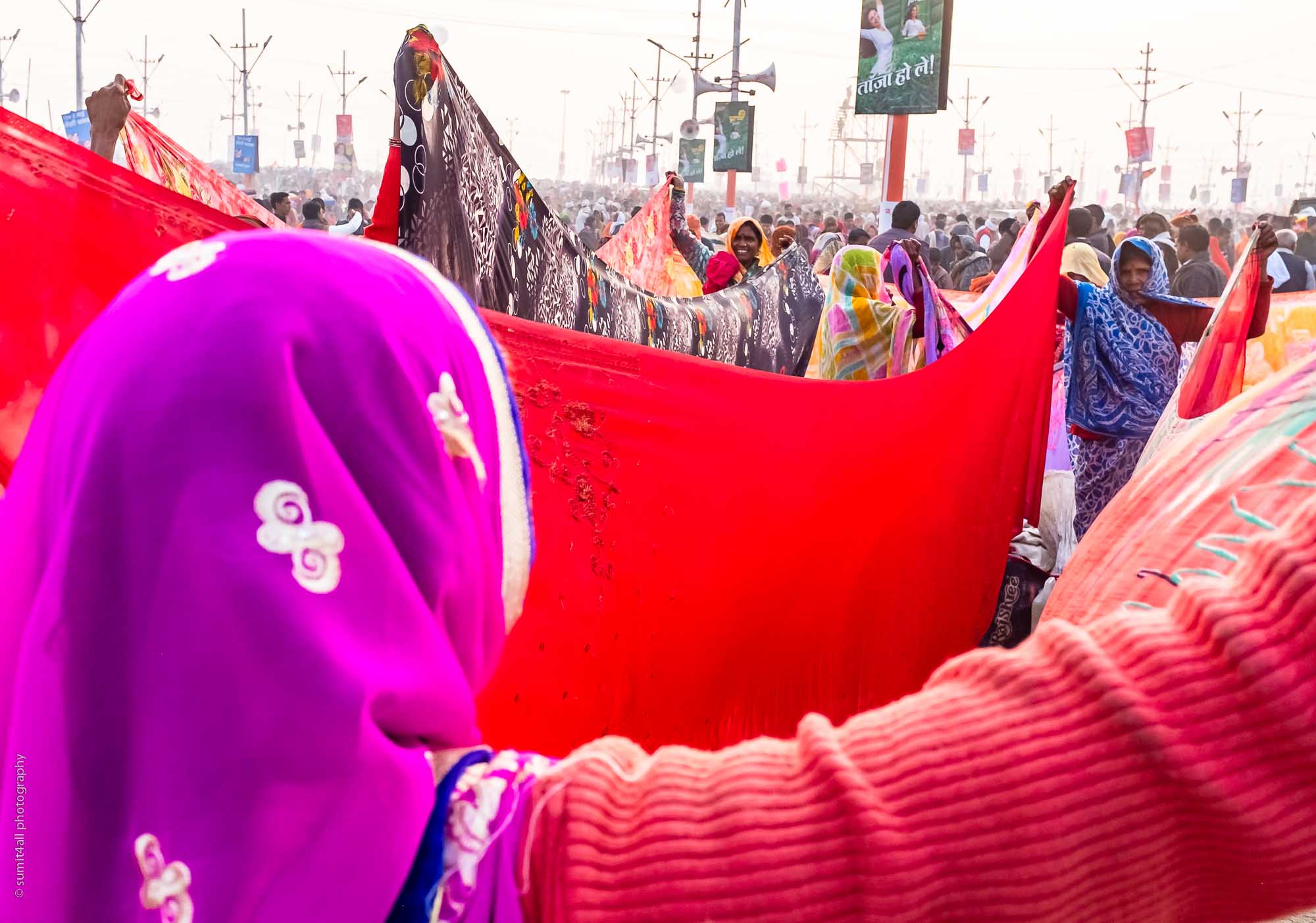 Women drying their Saris after taking a dip in the holy waters of river Ganga