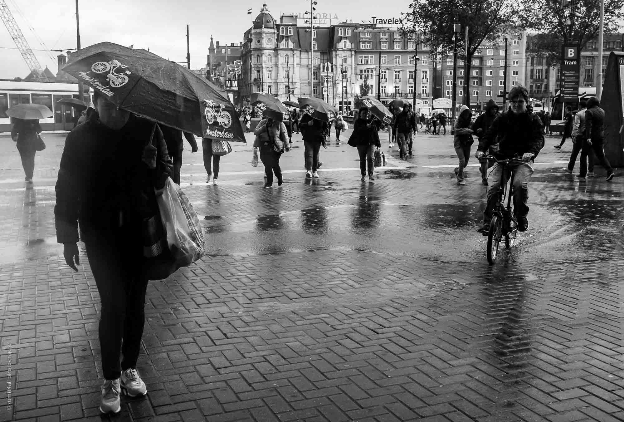 A Sudden Rainshower has People Running for Cover in Amsterdam