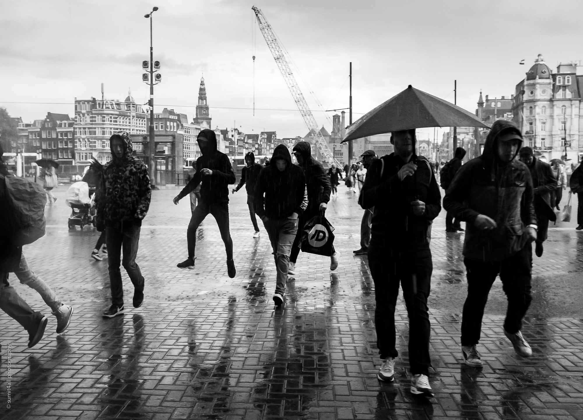 A Sudden Rain-shower has People Running for Cover in Amsterdam